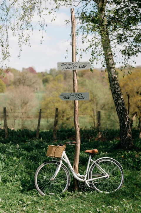 Bike leaning against signpost